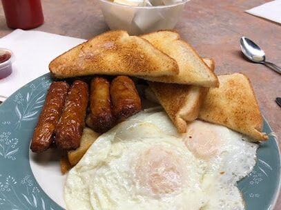 Breakfast plate with toast, sausages and eggs in Thorold, Ontario
