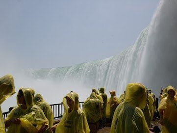 Crowd of people wearing yellow ponchos near Niagara Falls, Ontario